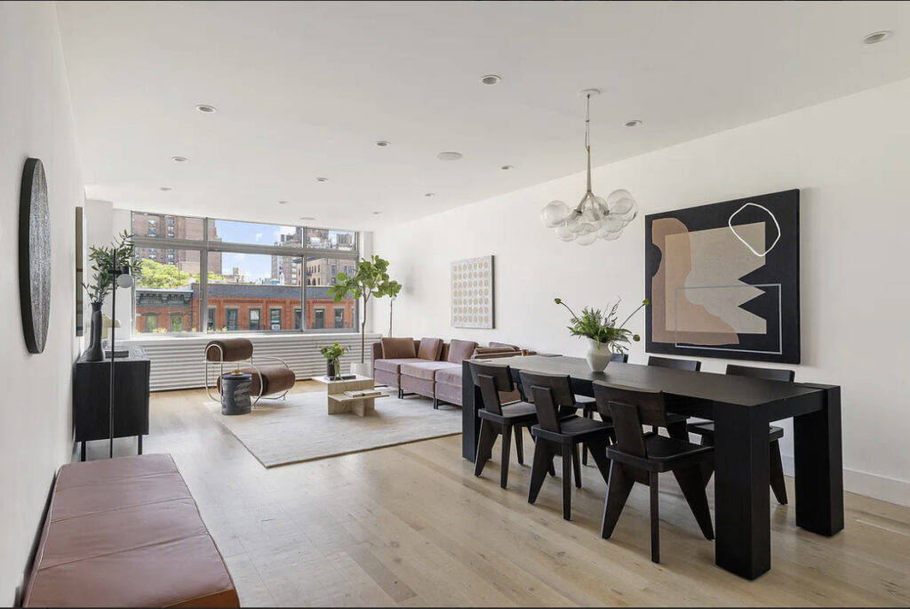 Modern open living and dining area with natural light and minimalist decor.